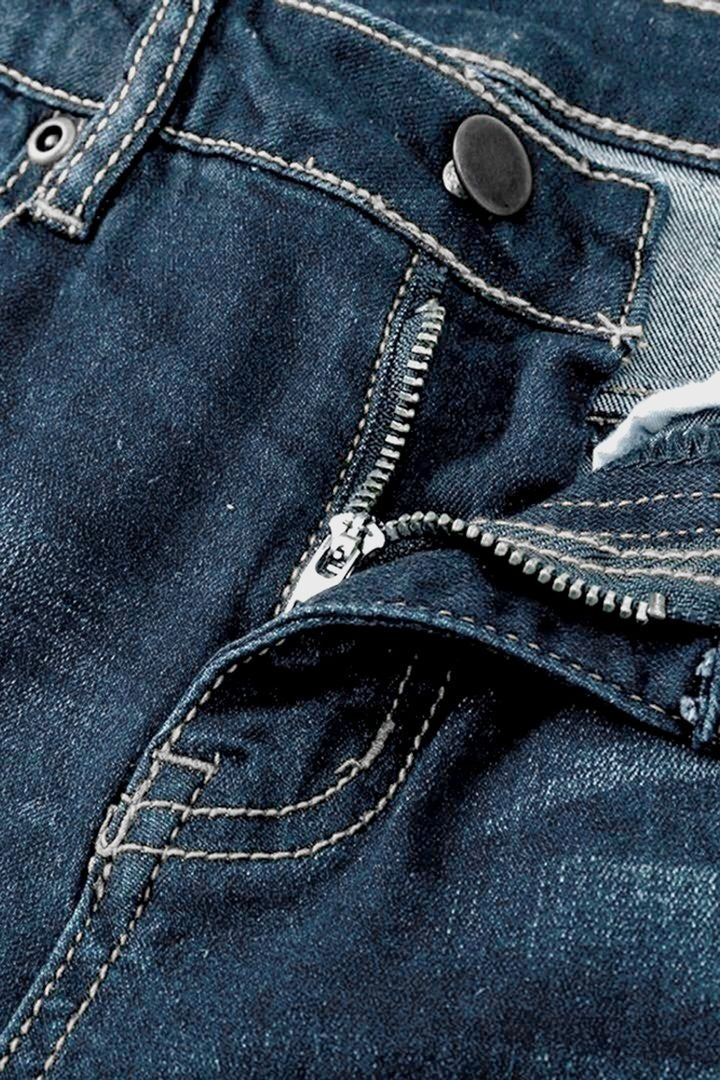 Jean vintage taille basse déchiré et boutonné